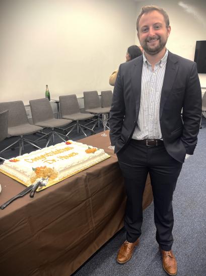 person posing with a cake